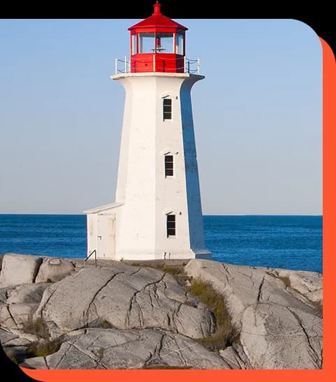 A lighthouse standing firm on a rocky shore